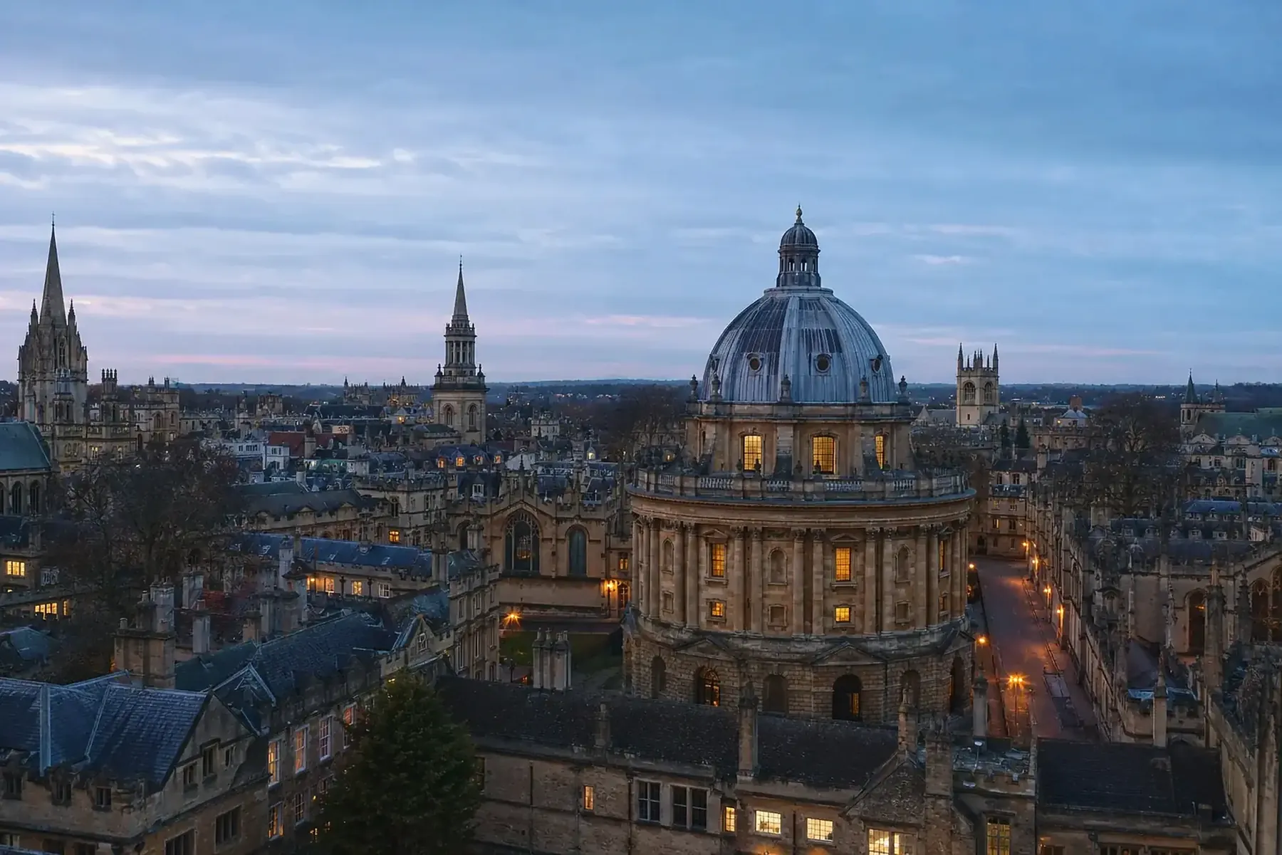 The Oxford skyline at dusk, with the dome of the Radcliffe Camera.