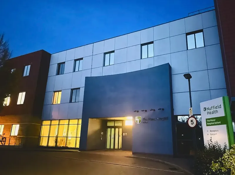 Nuffield Health The Manor Hospital, Oxford, at dusk.